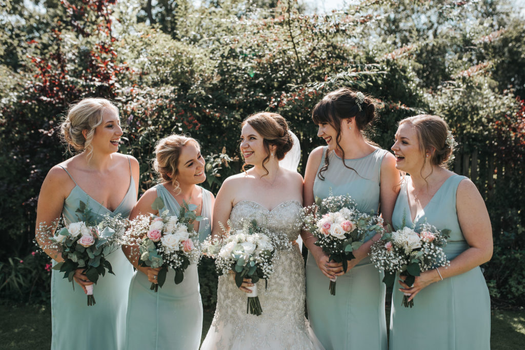  Low bun wedding hair styles for a bride and her bridesmaids